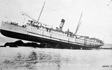 Photograph of the PRINCESS MAY on the rocks, as seen at low tide, circa 1920