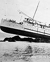 Photograph of the PRINCESS MAY on the rocks, as seen at low tide, circa 1920