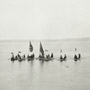 Photograph of the commissioners' fleet landing by canoe at Long Lake, July 1906