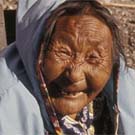Photograph of a smiling elderly Inuit woman, Arctic Bay (Ikpiarjuk/Tuninirusiq), Nunavut, circa 1974