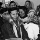 Photograph of a group of people meeting in a community centre, Pangnirtung (Pangnirtuuq), Nunavut, 1965